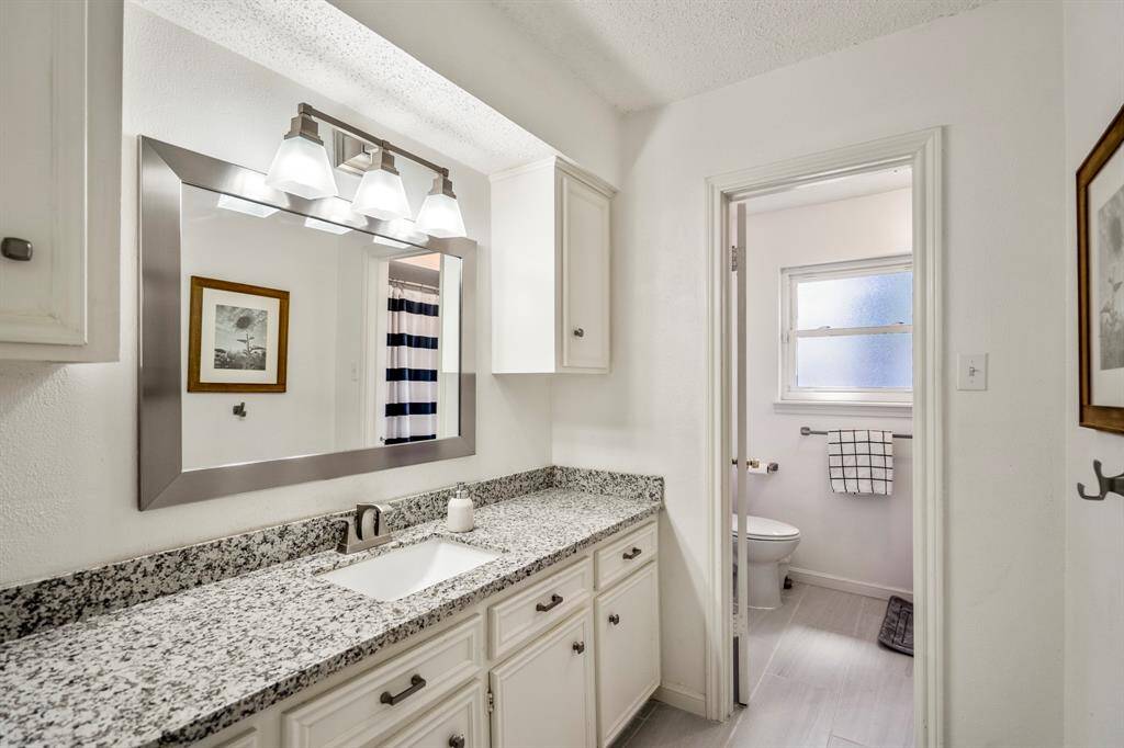 Second floor full bathroom with a separate water toilet and bathtub.