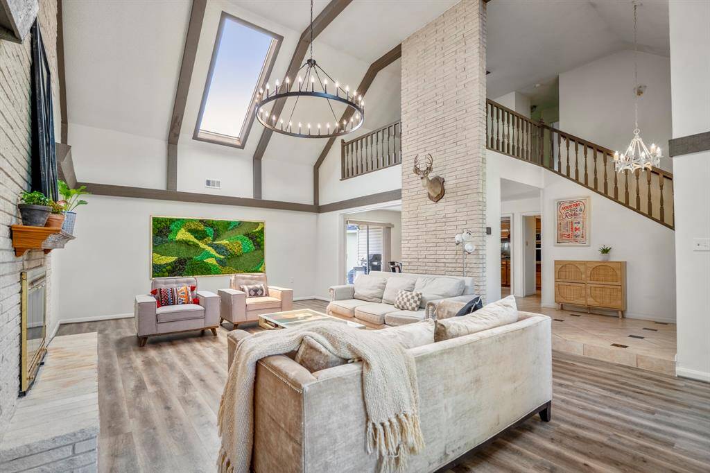 Your incredible living room with skylights and a two-story ceiling will be your favorite place in your new home.