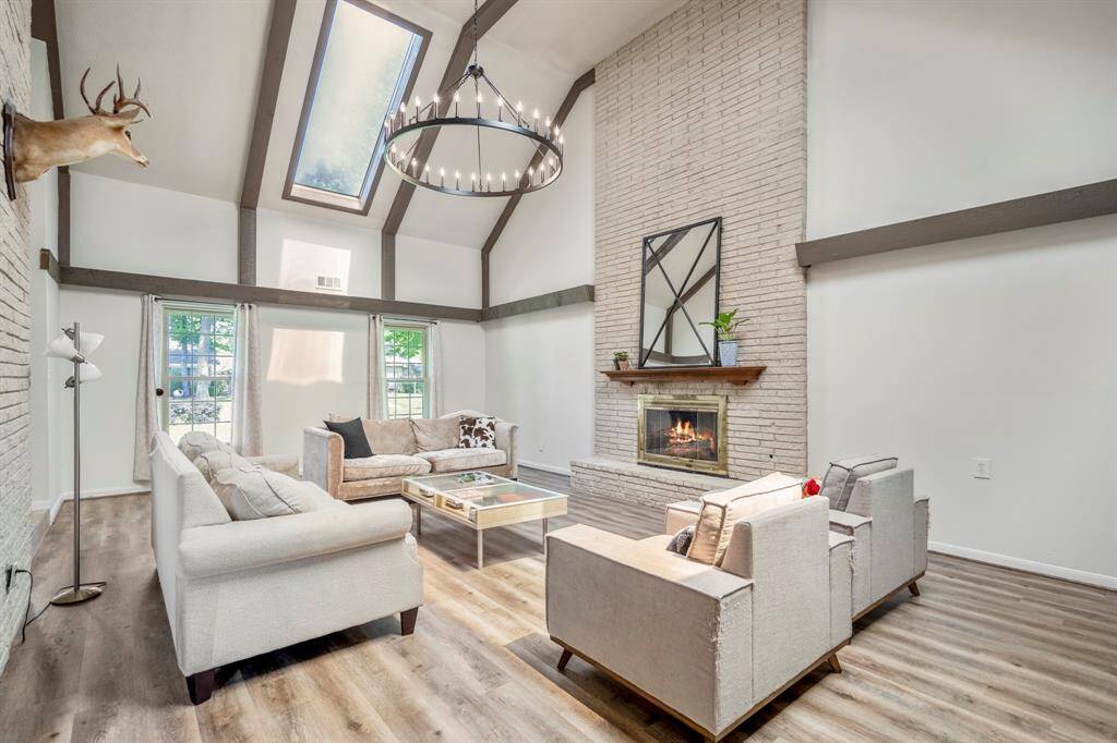 A reverse and closer look at this loving room with a gas fireplace.