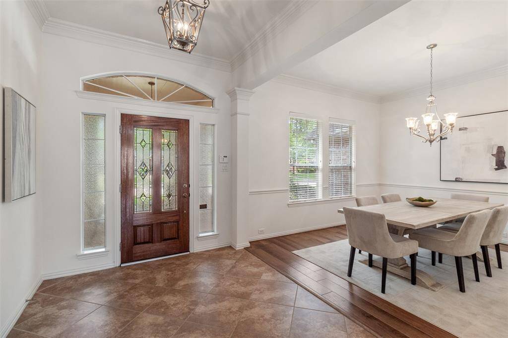 Inside you are greeted by a large entry way, and dining room to your left.