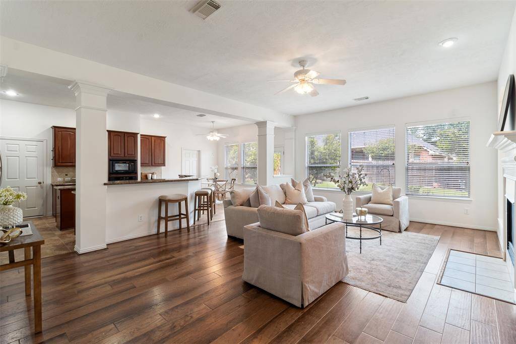 Beautiful wood floors flow throughout the home and large windows provide  plenty of natural light.