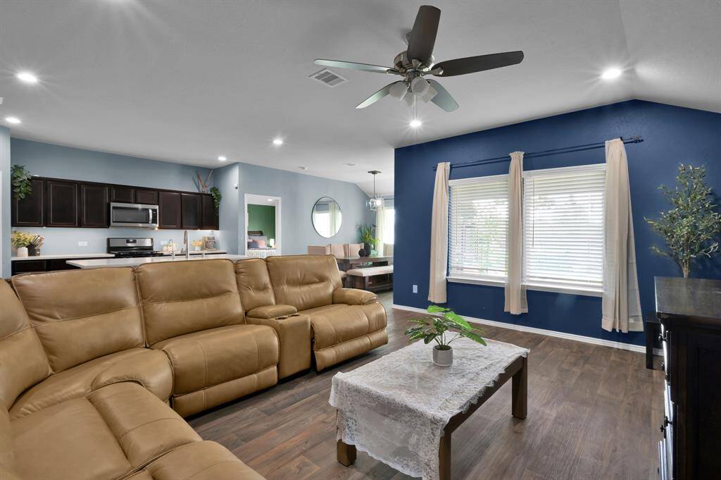 The windows from your living into your backyard will give you a great view of the luxurious landscaping in the back! (Stick around for those photos!)