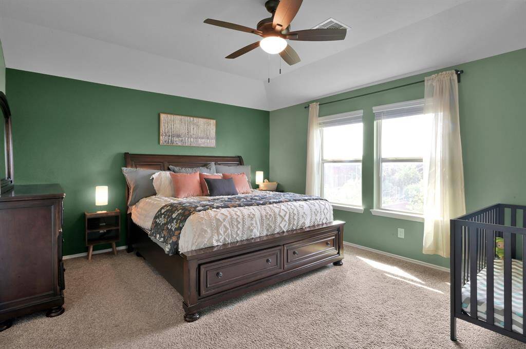 The primary bedroom is HUGE and can accommodate several large furniture pieces.