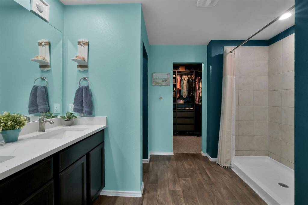 Welcome to your primary bath retreat. It currently has a coastal theme, but has all of the right elements to make for a relaxing spa bathroom experience!