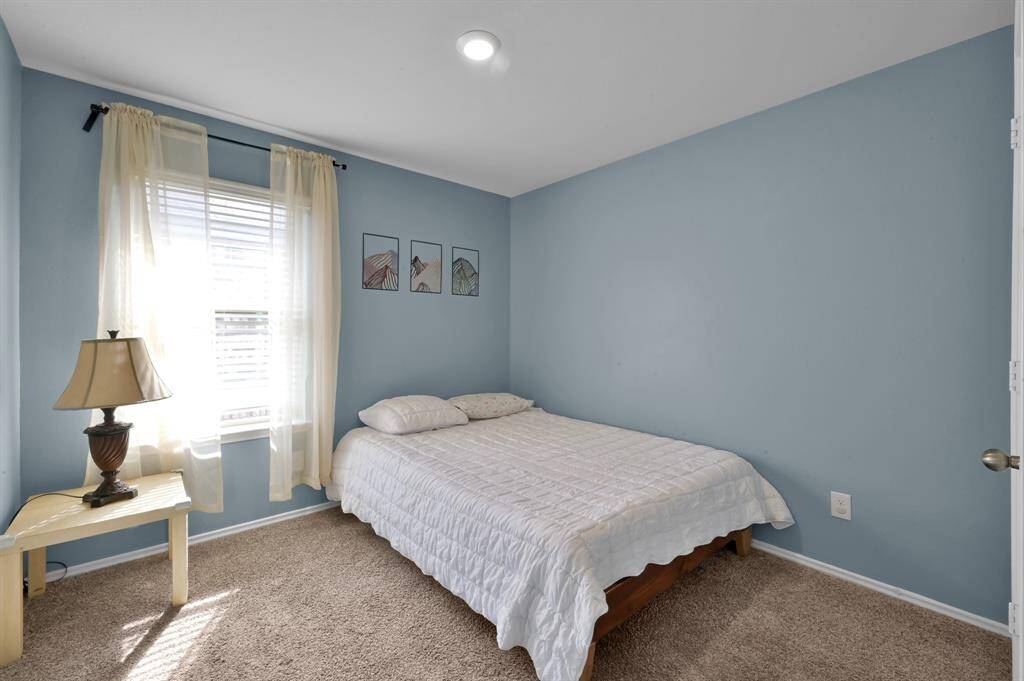 This secondary bedroom is located toward the front left side of the home.  It enjoys great natural lighting!