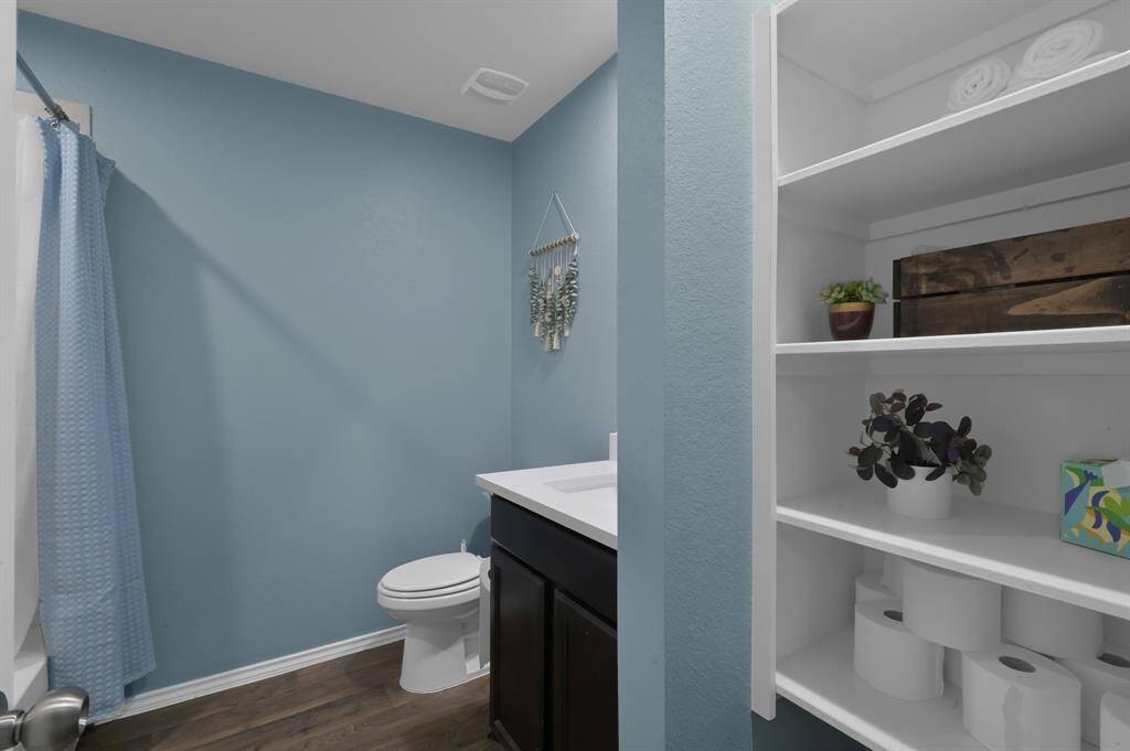 Secondary bathroom has great storage space. The quartz countertops are in every single bathroom elevating each space and making them more practical for every day living.