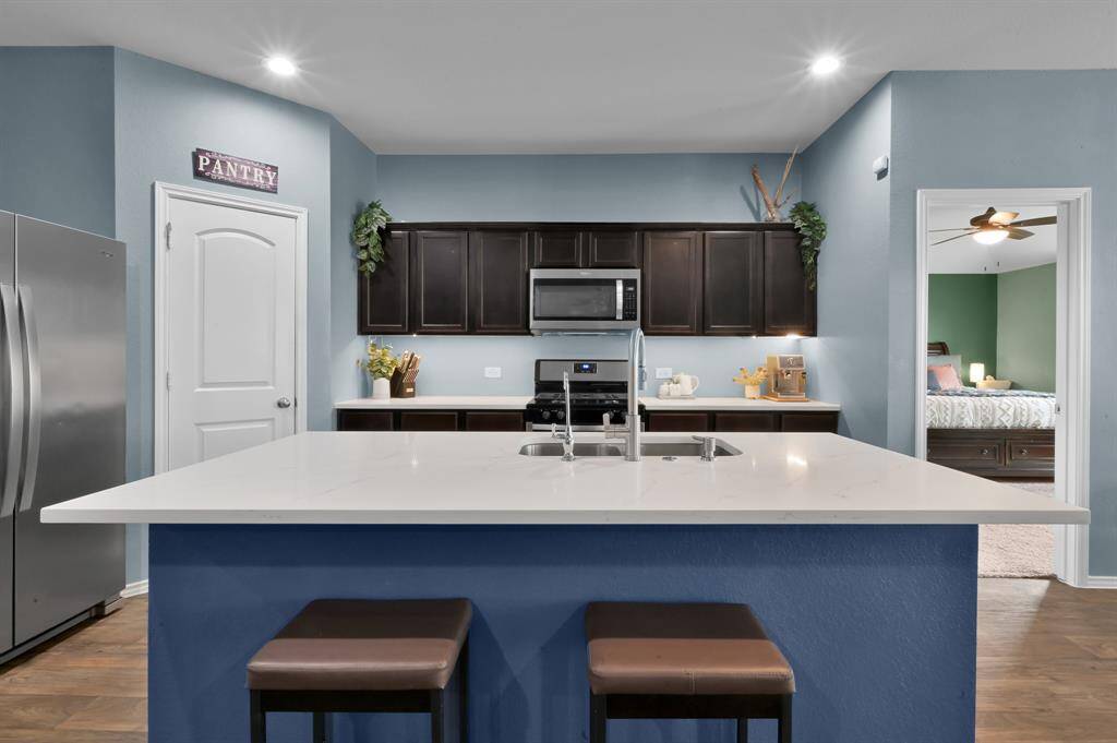 Notice that this is one of the only home's in the neighborhood in this price range with quartz countertops. They are modern, beautiful, and can accommodate a large buffet during holidays!