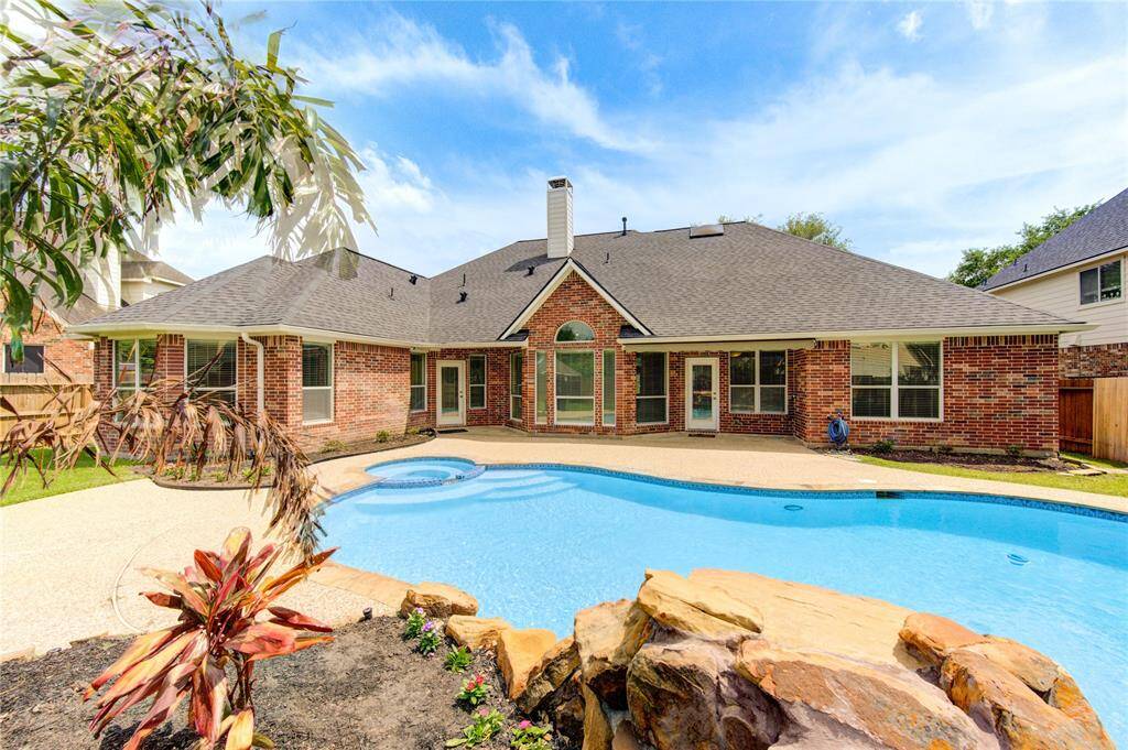 Stunning backyard oasis with a sparkling pool—perfect for relaxing and entertaining!