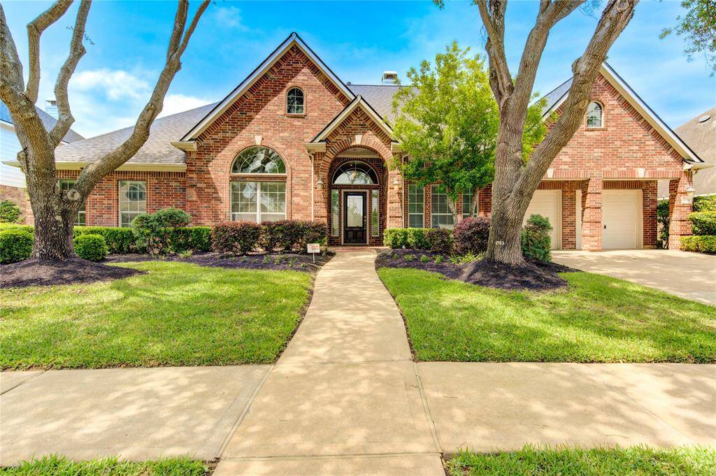 Welcome to 21114 Falcon Creek—your Home Sweet Home with charming curb appeal!