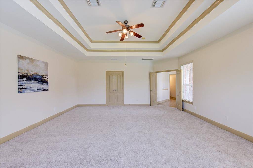 Oversized primary bedroom filled with natural light—spacious, bright, and perfect for relaxing in comfort.