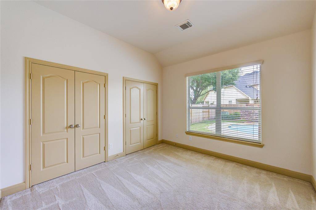 Bright secondary bedroom with double closets and plenty of space.