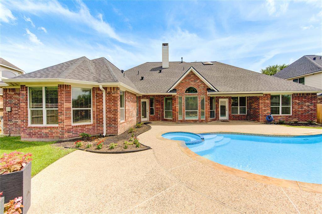 Gorgeous outdoor pool with plenty of deck space for loungers—ideal for sunbathing and entertaining.
