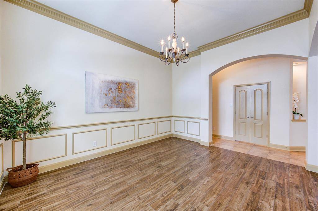 Perfect for entertaining, this open dining room has ample space for a large table and sideboard.