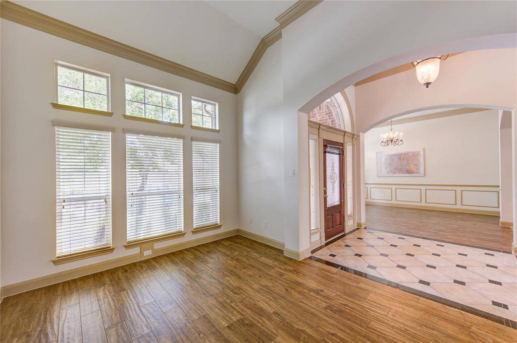 Elegant formal living room with versatile space—perfect as a stylish sitting area or a functional home office.