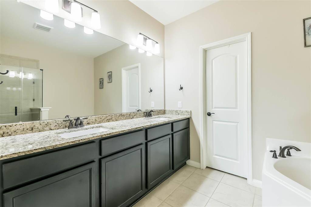 Double sink vanity with granite counter tops