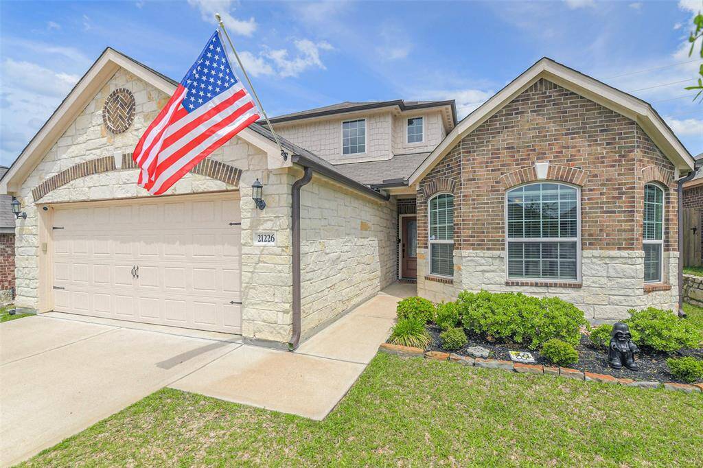Beautiful stone and brick exterior makes for an eye catching curb appeal