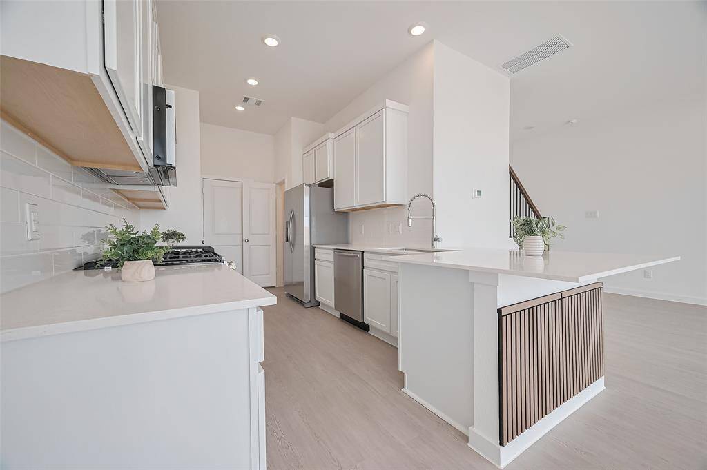 Modern and spacious kitchen with quartz. countertops
