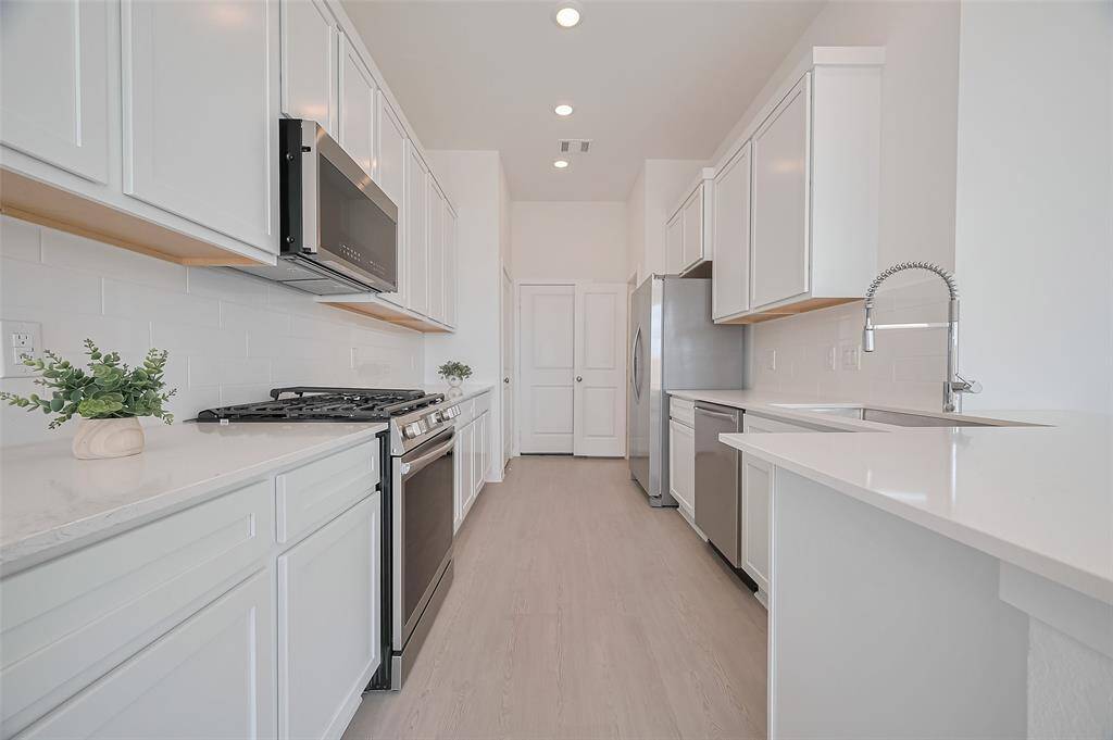Kitchen equipped with stainless steel appliances.