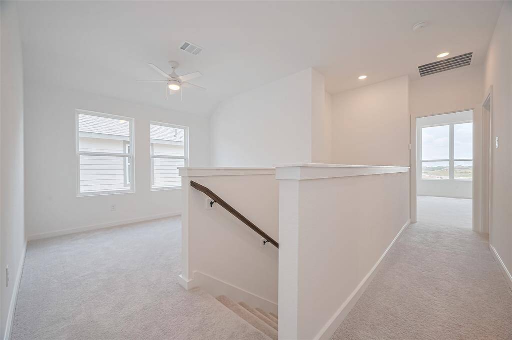 Flexible open space, perfect for a home office, game room, or additional living area.