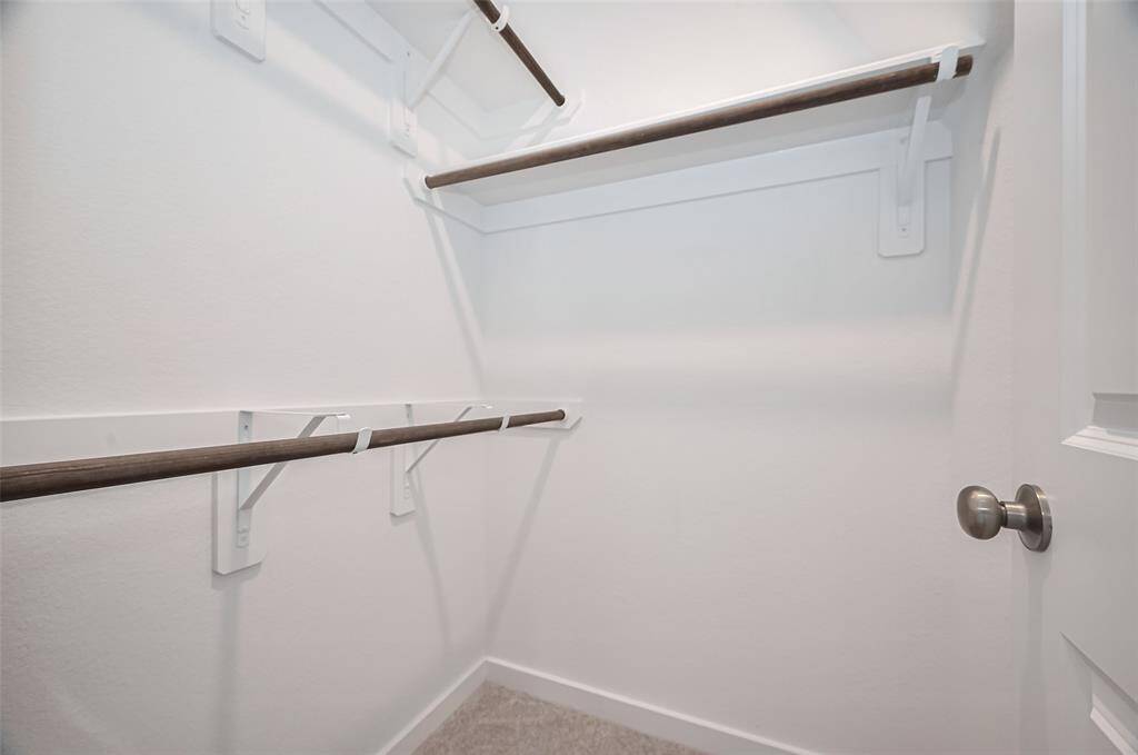 Comfortable walk-in closet in the first secondary bedroom.