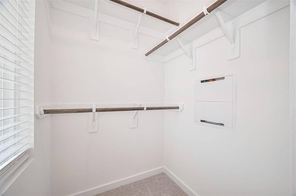 Comfortable and cozy walk-in closet in the 2nd. secondary bedroom.