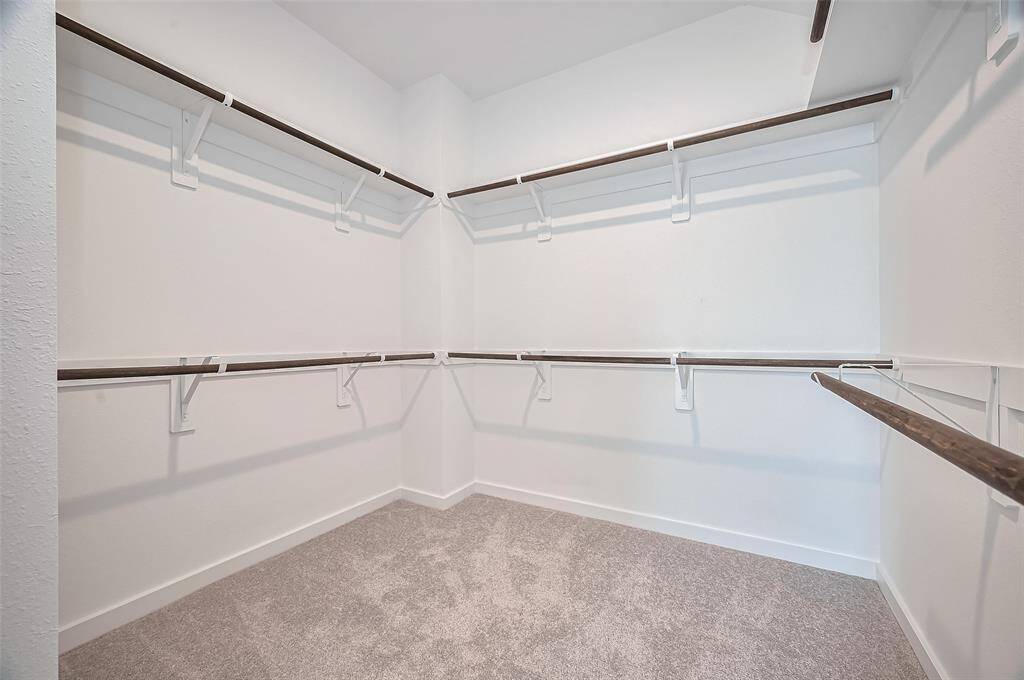 Huge walk-in closet in primary bedroom.