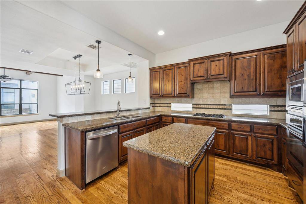 You'll find a chef's kitchen with sprawling countertops and abundance of storage.