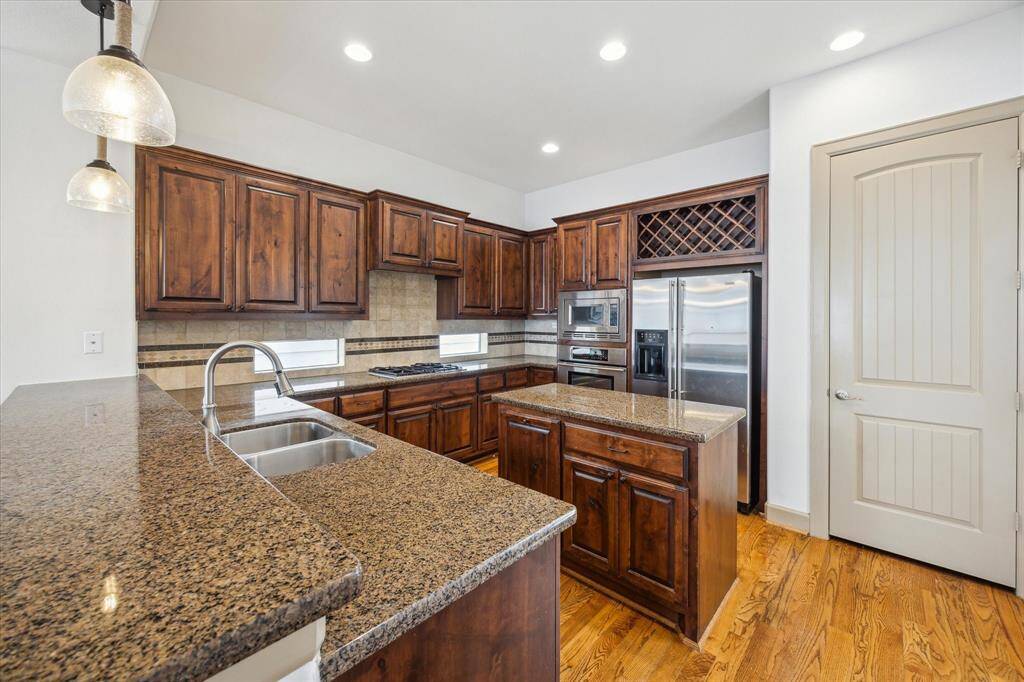 Bar seating, large pantry and door to outdoor patio terrace allowing ease for grilling.