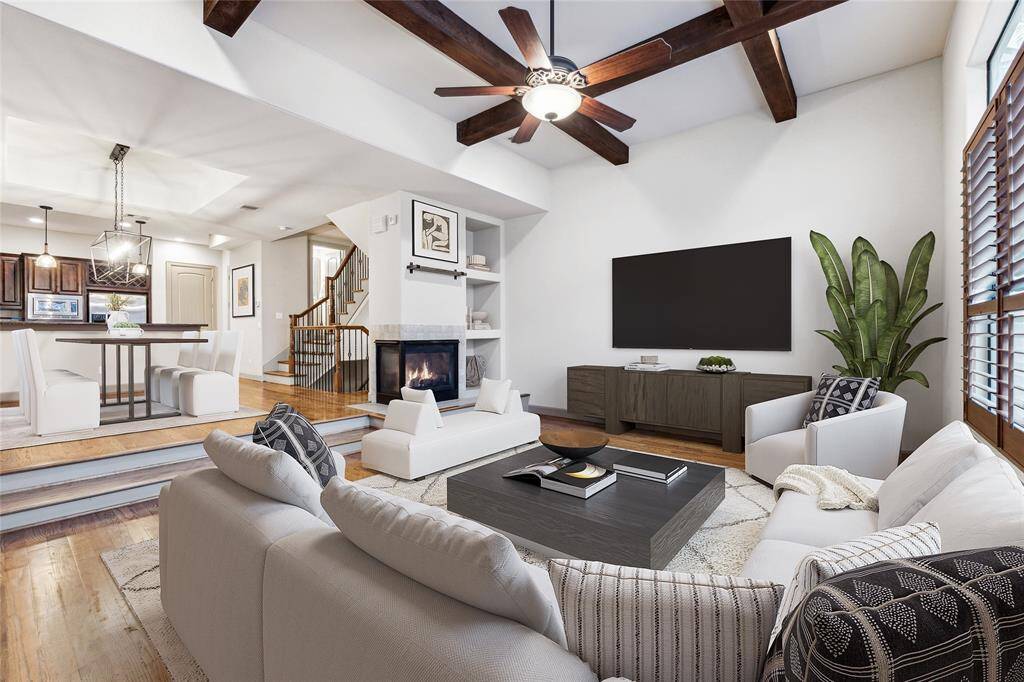This home boasts transitional living space, a plethora of natural light, soaring ceilings and more! Digitally staged image.