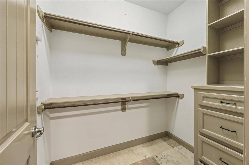Glimpse into dual closets with built in details.