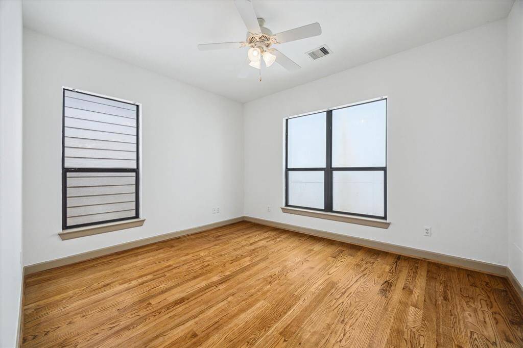 A generously sized secondary bedroom found on same third level as primary bed.