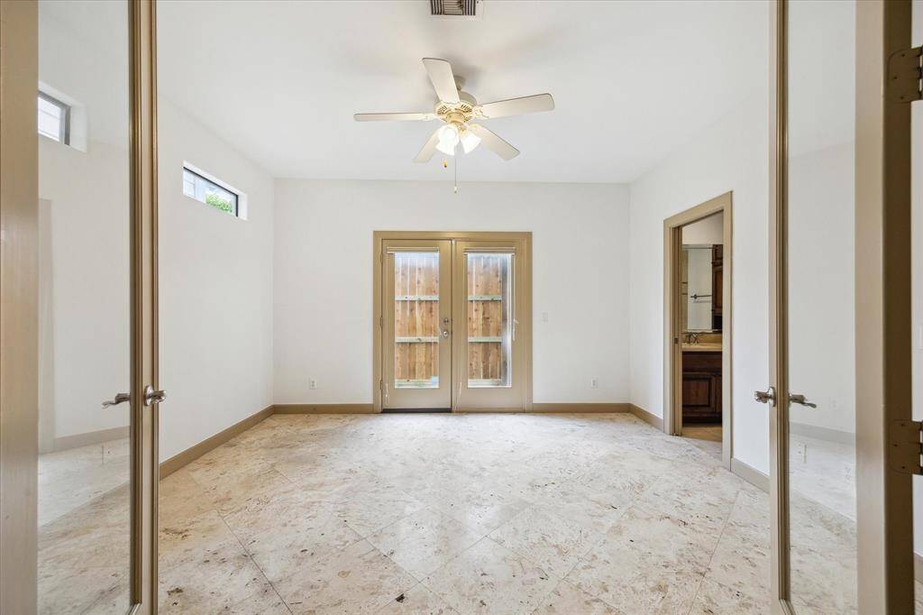 Enter through double doors to the third bedroom found on the first floor. Making for a great guest suite allowing privacy.