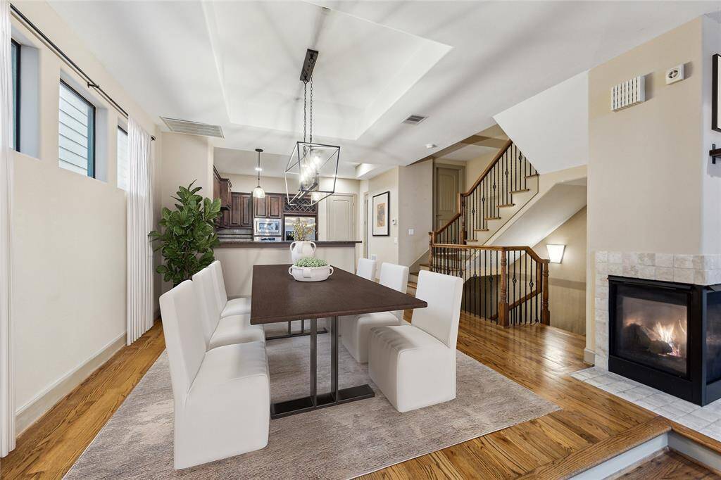 An inviting dining area - Overlooking both kitchen and living. Please note additional bar seat. Digitally staged image*