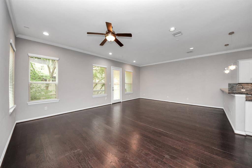 The living room leads out onto a private second floor balcony.