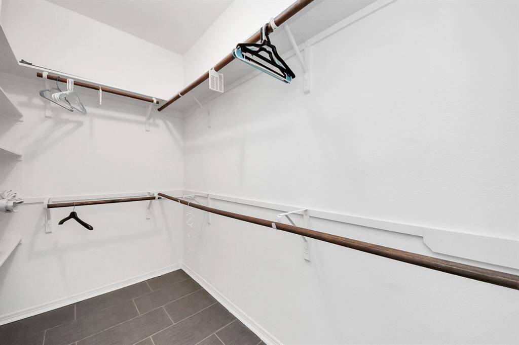 Walk in closet in primary bedroom