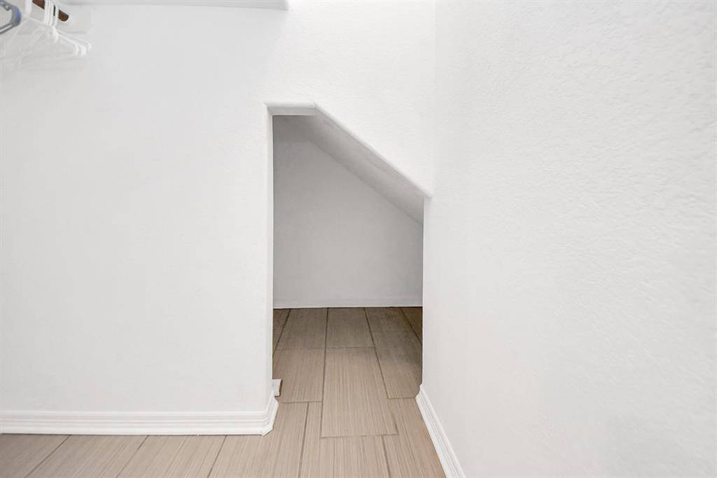 Ensuite closet with additional under stair storage