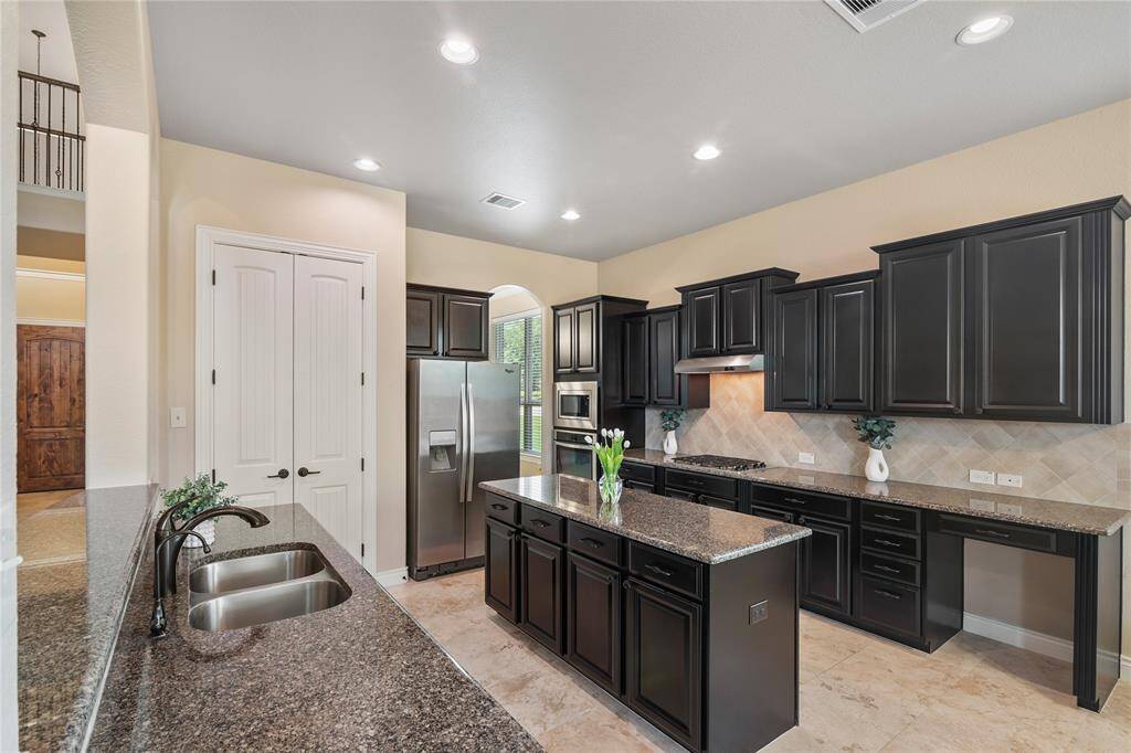 This charismatic kitchen has extensive workspace, and amazing storage space for every need.