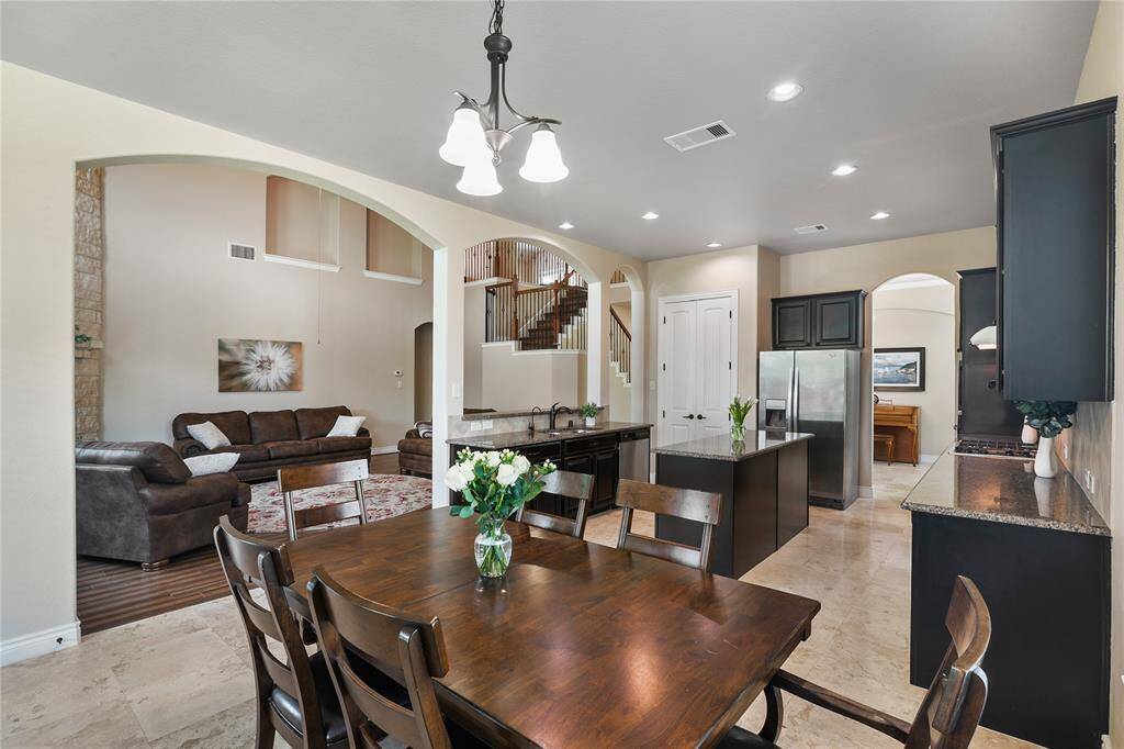 The expansive breakfast area has a harmonious view to the family room and the cherish backyard.