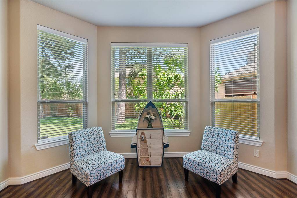 The enjoyable sitting area in the primary bedroom with a dazzling view.