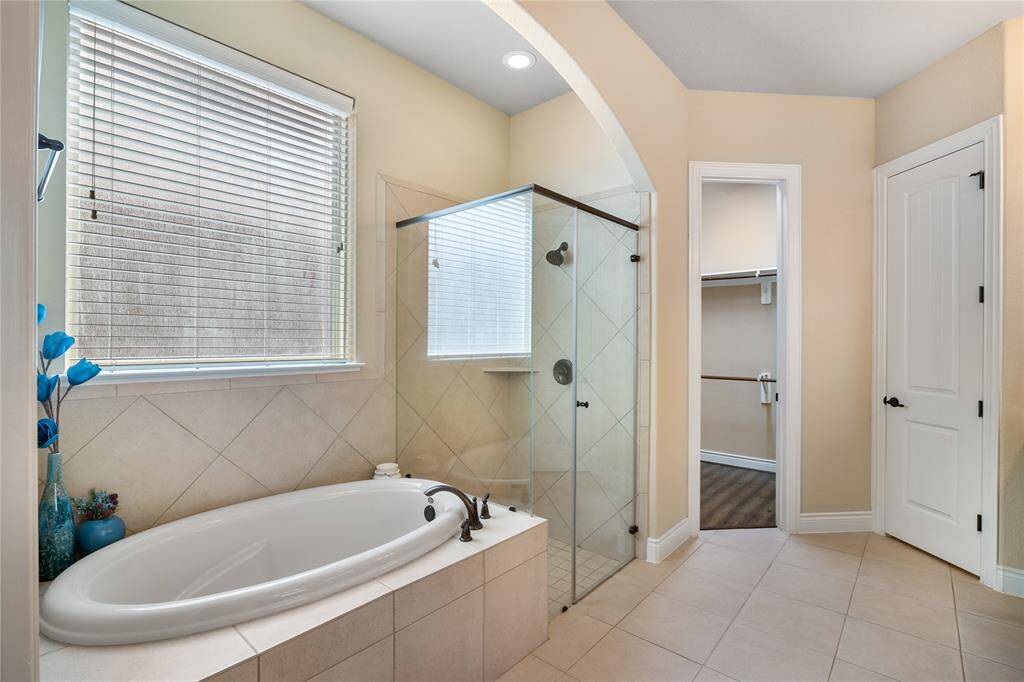 Includes a soaking tub for a relaxing afternoon, elegant shower and amazing natural light.