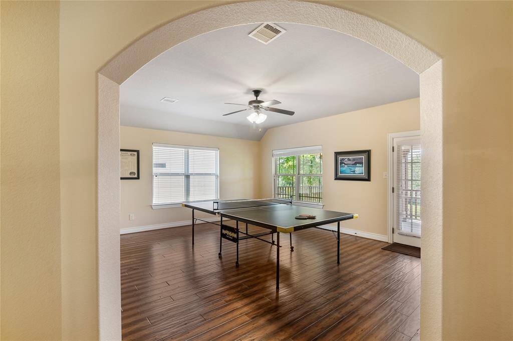 The view of the charismatic game room that has access to the charming oversized front balcony.