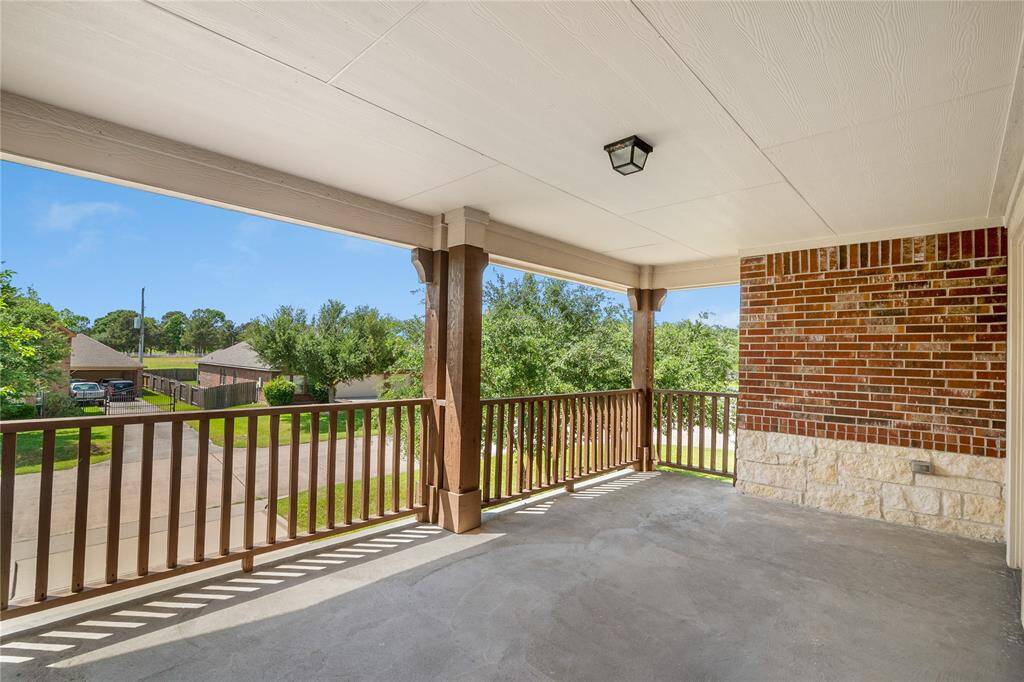 Panoramic views of the peaceful neighborhood from this remarkable front balcony.
