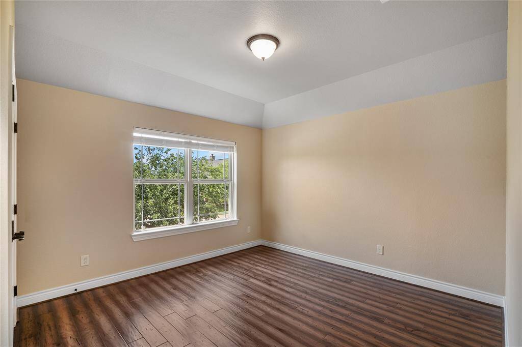 Beautiful front bedroom. Each bedroom has engineered wood floors.