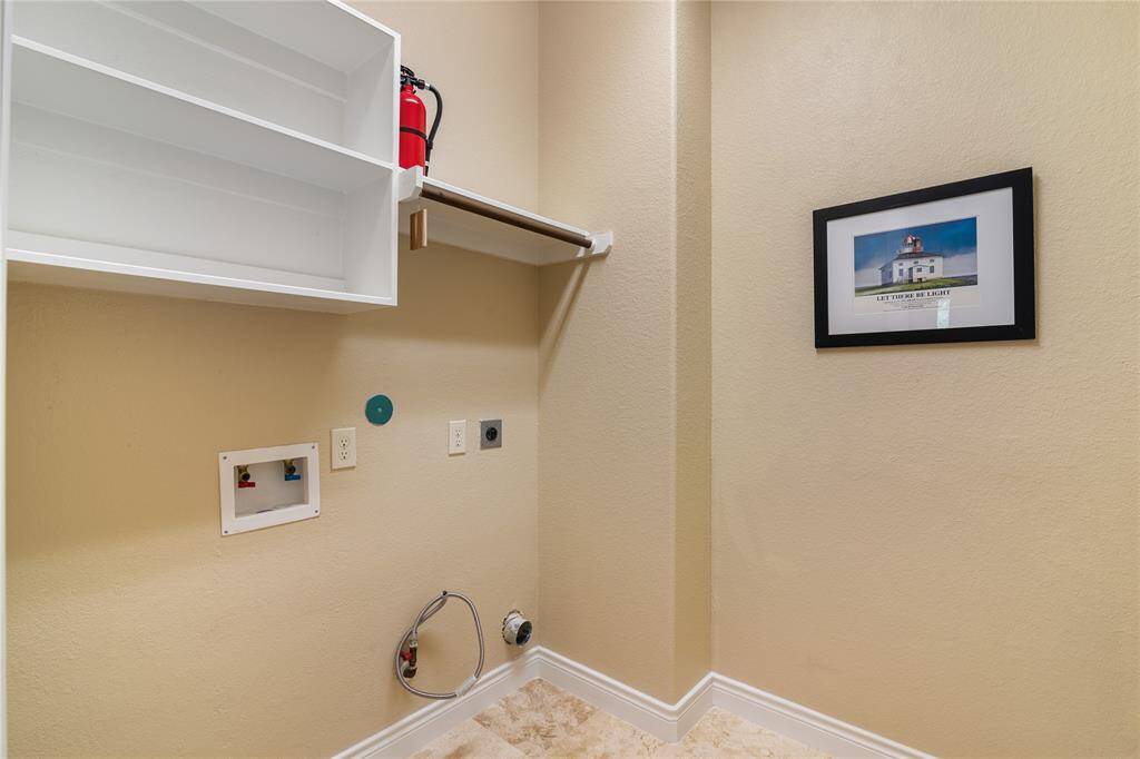 The laundry room has connections for electric and gas dryer.