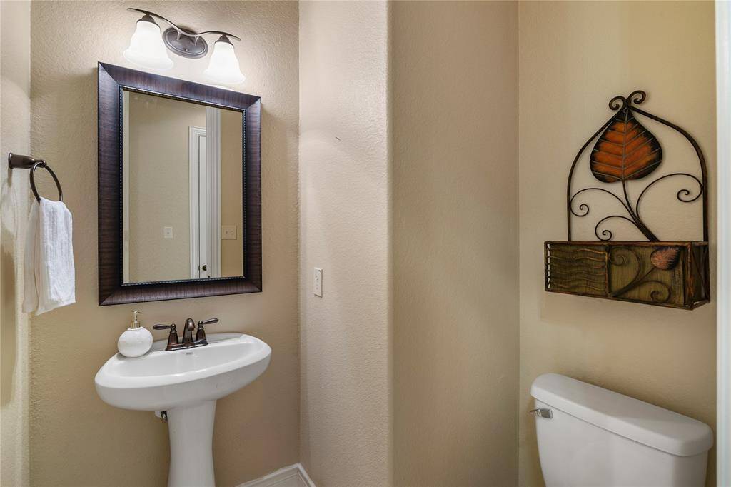 Lovely half bathroom ideally located.
