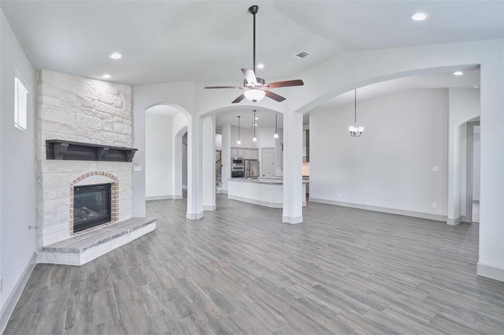 Open concept living area connected to kitchen and breakfast area