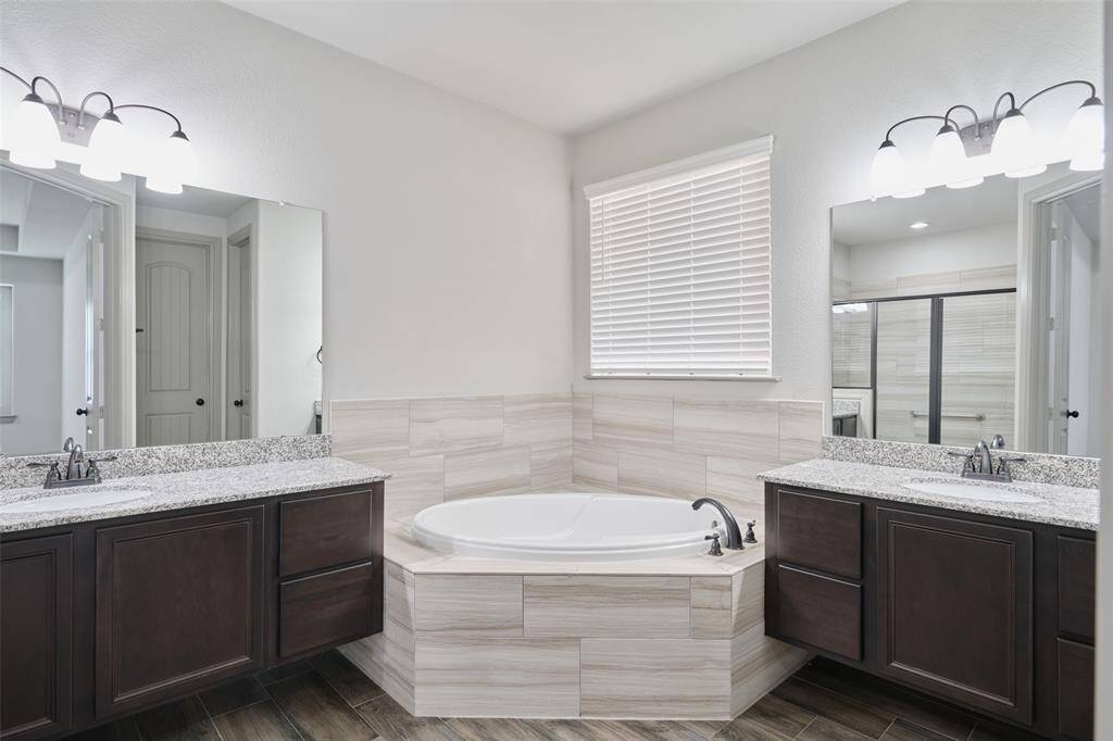 Luxurious Primary Bath with beautiful tile throughout.