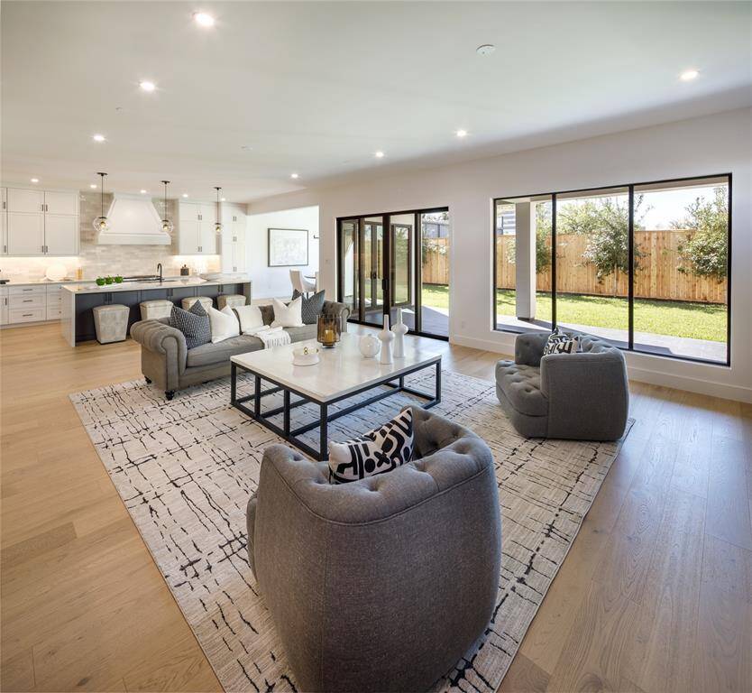 A prime Upper Kirby stunning New construction designed with utmost thought and care. Inviting front elevation revealing the extra wide driveway, over-sized two car garage and the professional landscaped grounds