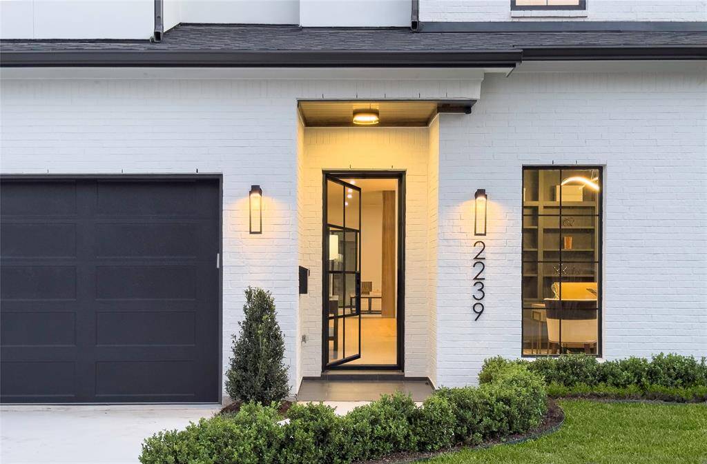 Entry front door of elegance complimenting the home and ready to roll out the welcome mat.