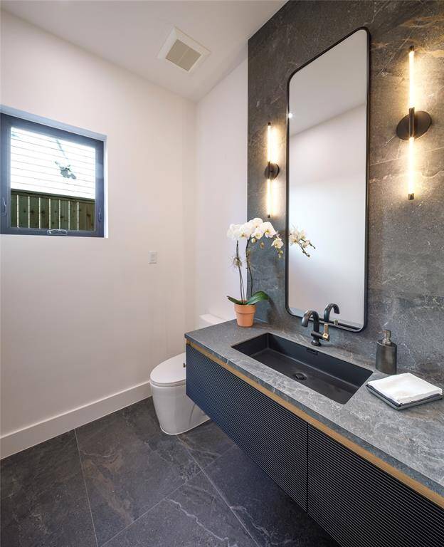 Impress your guests with this elegant unique powder room